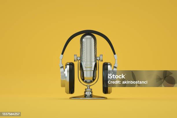 Retro Old Microphone And Headphones Vintage Style Yellow Color Background Stock Photo - Download Image Now