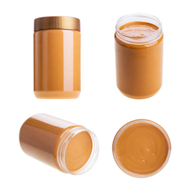istock Jar of peanut butter on a white background 1337565580