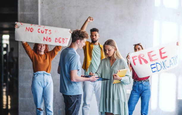 university students activists protesting indoors, fighting for free education concept. - petition imagens e fotografias de stock