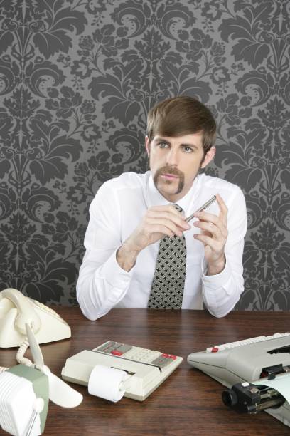 istock retro mustache businessman office desk 1337583167
