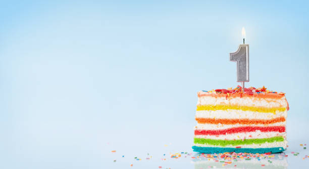 istock Birthday or holiday cake with burning candles on a blue 1337585777
