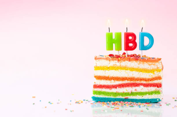 istock Birthday cake with candles on a pink 1337585797