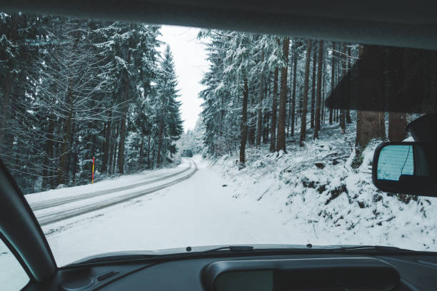 istock Winter forest road from the inside car 1337585877