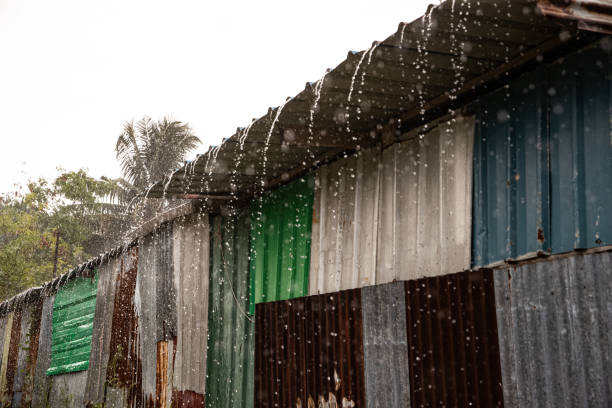 Monsoon in the Maldives as water pours off a tin roof