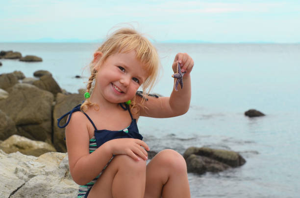 istock happy kid fun in summer beach sea vacation 1337587207