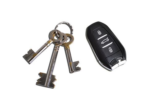 Old fashioned house key and car key (Clipping Path) on the white background
