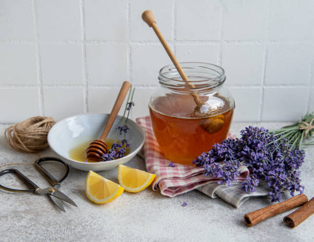 istock Jar with honey and fresh lavender flowers 1337592425