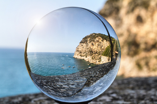 Panoramic view of  a cliff in Gaeta through a crystal ball