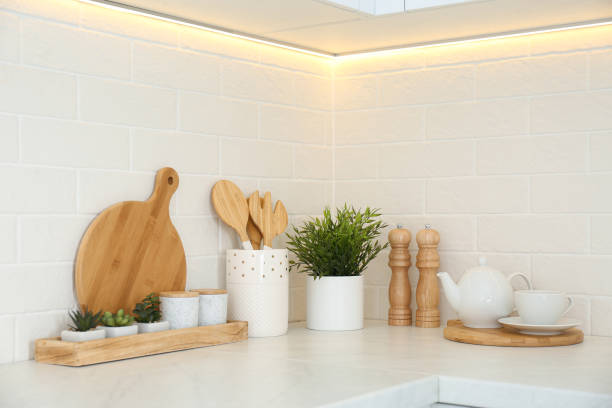 istock Kitchenware and houseplant on countertop in modern kitchen 1337595494