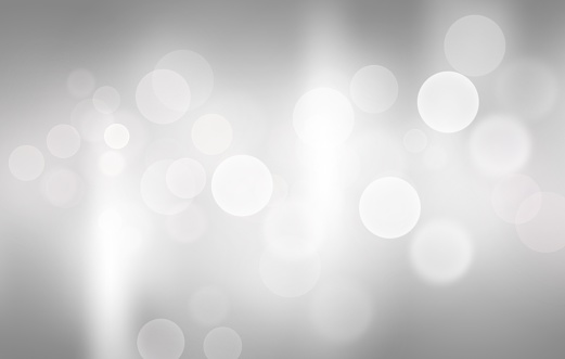 Gray abstract background. white bokeh blurred beautiful shiny lights. use for Merry Christmas, happy new year wallpaper backdrop and your product.
