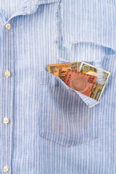 istock Ripped shirt pocket with last remaining banknotes 1337596565