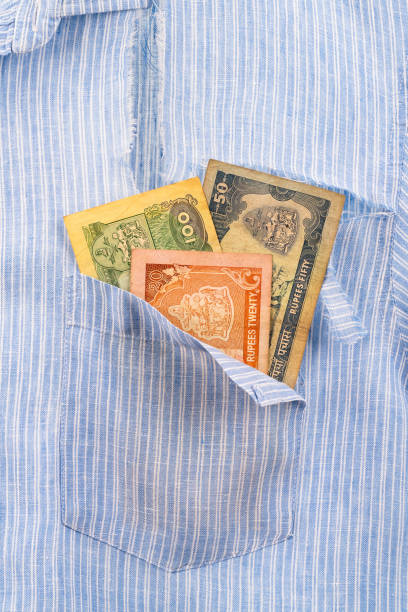 istock Ripped shirt pocket with last remaining banknotes 1337596602