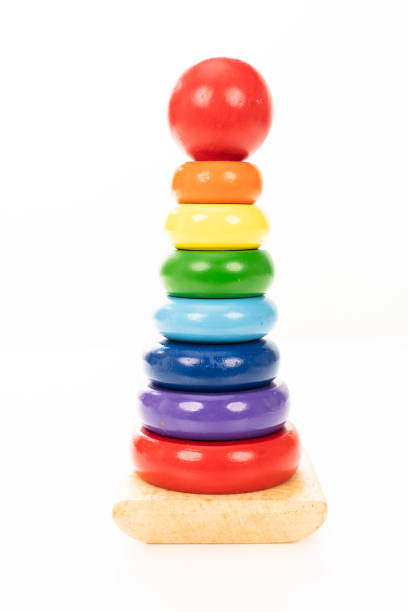 istock Wooden stacking rings toy on white background 1337596684