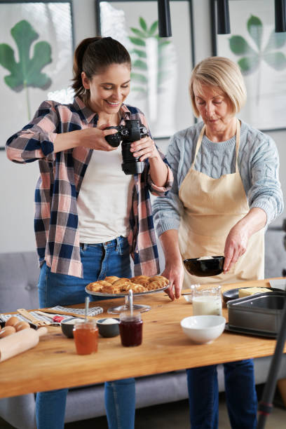 Vertical image of two food bloggers Vertical image of two food bloggers cooking class photos stock pictures, royalty-free photos & images