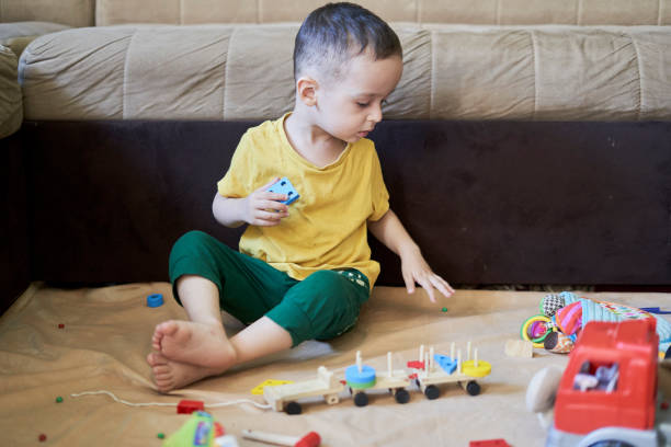 istock 3 years old kid playing at home 1337597221
