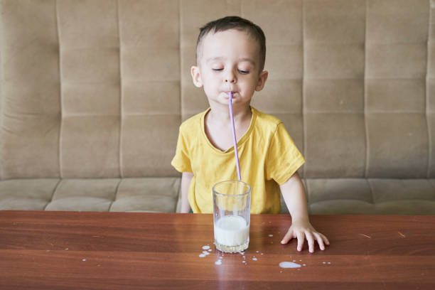 istock A little kid drinking milk with straw 1337597956