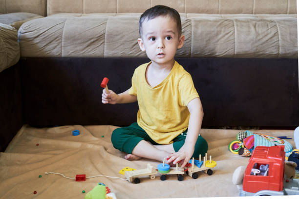 istock 3 years old kid playing at home 1337598037