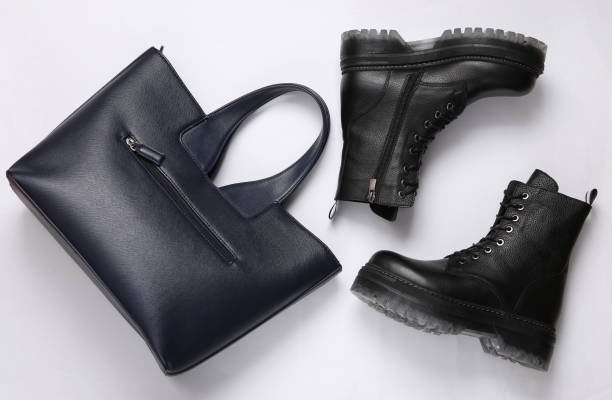 istock Leather boots and bag on white background. Top view. Flat lay 1337599417