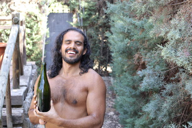 istock Man opening a champagne bottle 1337601987
