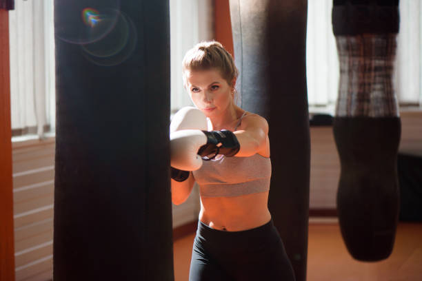 istock A female boxer train hard in a boxing studio. 1337602096