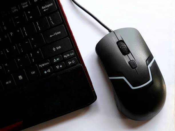 istock Black laptop and black mouse on white background 1337607114