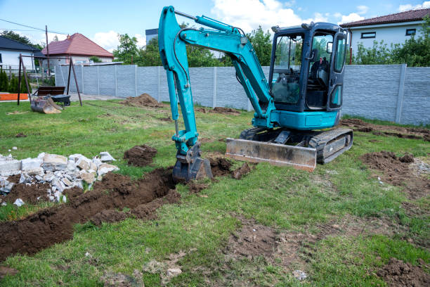 istock Small excavator is digging a foundation for a house 1337607137