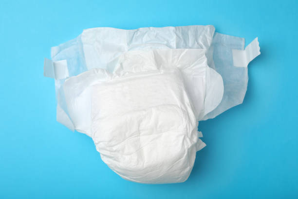 istock Baby diaper on light blue background, top view 1337607435