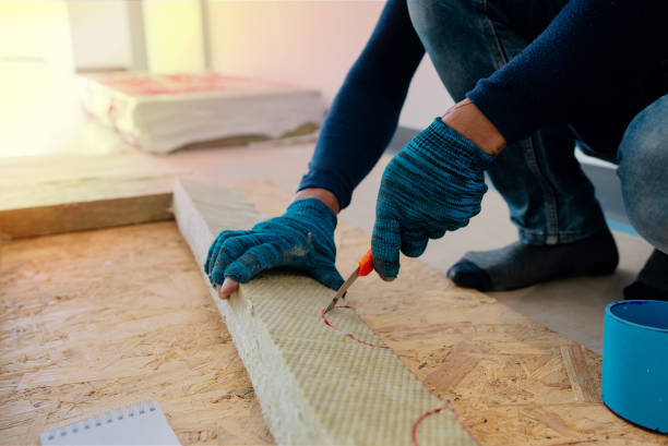 Glove-wearing Asian workers are using a Fire barrier grade clutch to deploy to a construction Zone installation.