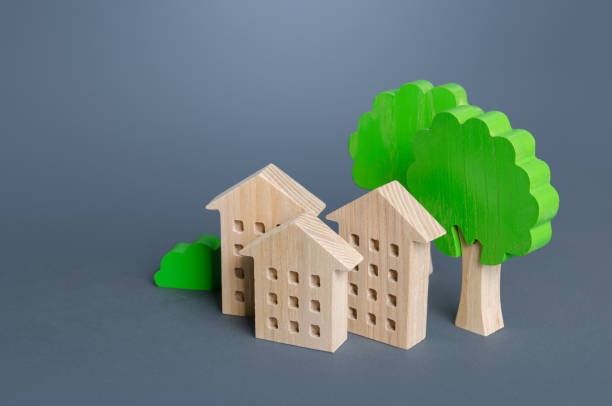 istock Residential buildings among the trees. Environmentally friendly, energy efficiency, zero carbon emissions. Buying and selling real estate. Renting housing, Real Estate Agent services. Carbon neutrality. 1337609799