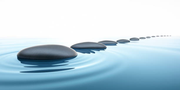 istock Stones in calm water - light scene 1337611377