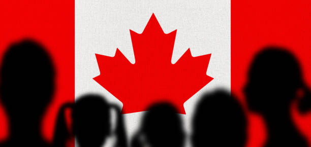 istock Silhouette People with Canadian Flag 1337612245