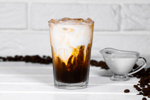 istock Iced Coffee with milk on white background, Summer refreshment drink, Coffe Bean 1337613211