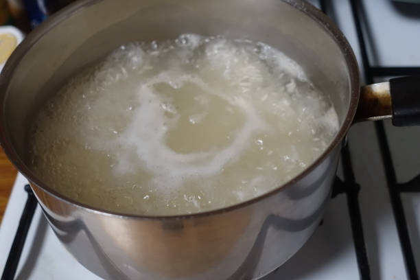 istock Boiling water in a saucepan for cooking rice 1337615345
