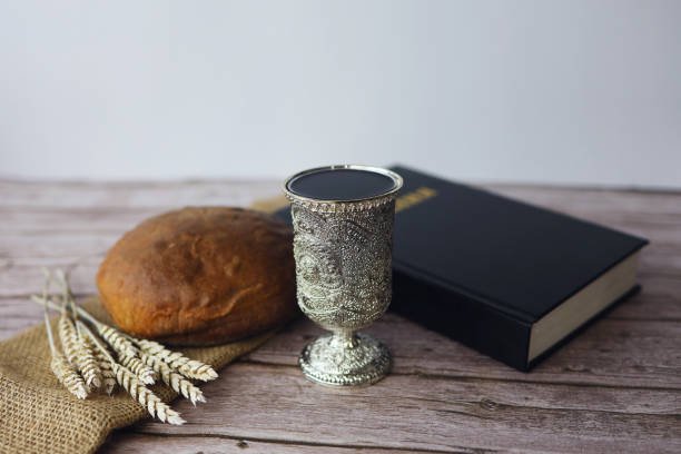 Chalice with wine and bread. Background with copy space stock photo