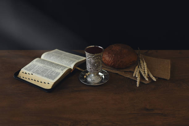 istock Chalice with wine and bread. Background with copy space 1337619277