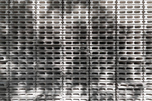 Closeup of grey concrete block wall with nature shadows