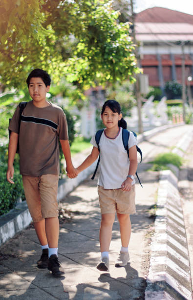 istock Brother and sister back to school 1337622425