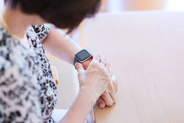 istock Japanese senior woman using smart watch 1337622692