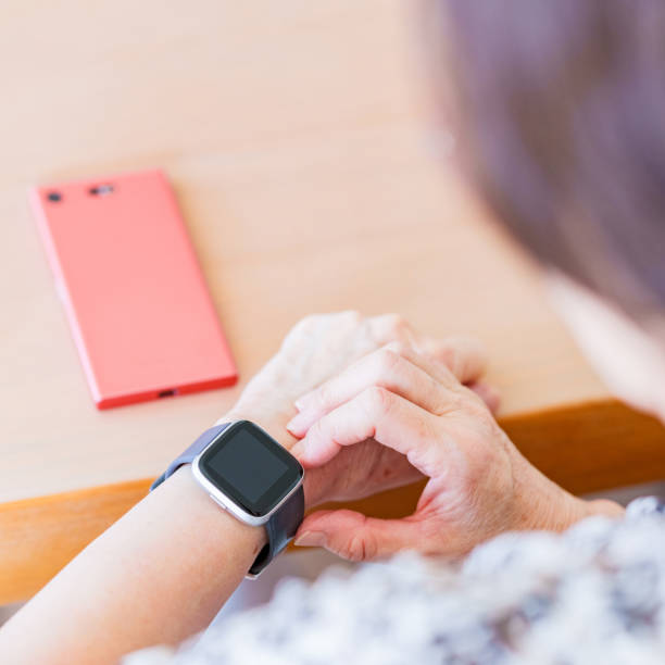 istock Japanese senior woman using smart watch 1337622697