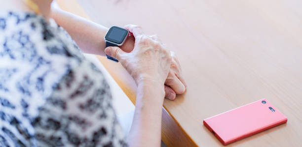 istock Japanese senior woman using smart watch 1337622703