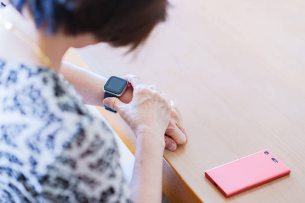 istock Japanese senior woman using smart watch 1337622705