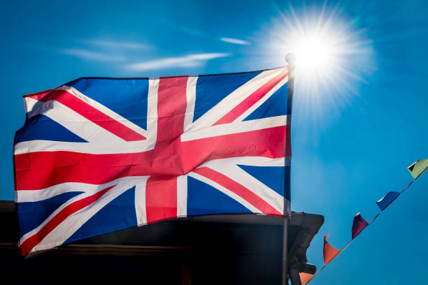 istock Brilliant sunshine behind Great Britain flag and bunting 1337622760