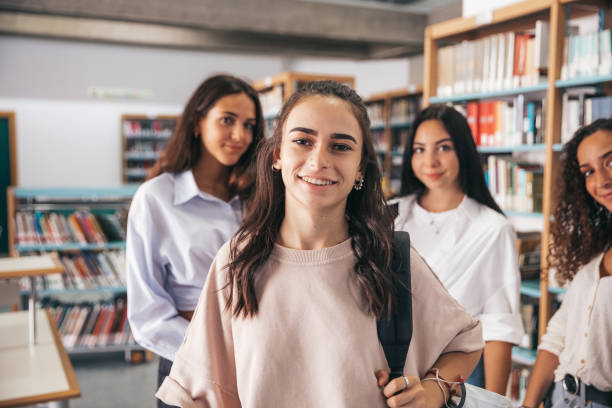 istock Confident women students in the public library 1337623513