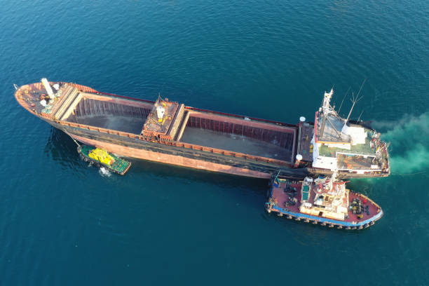 istock A tug pulls a cargo ship in the port. View from above. Shooting from a drone. 1337626230
