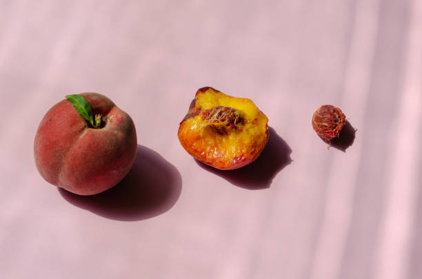 istock Minimalist composition with peaches on a pink background. Ripe, 1337626376
