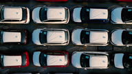 istock Huge storage parking lot, Cars lined up, Depot of new cars ready to be distributed, Aerial top view Large RoRo (Roll on/off) for carrier vessel convoy cars or vehicle into and out of the world market, Regular background sample image 1337626553
