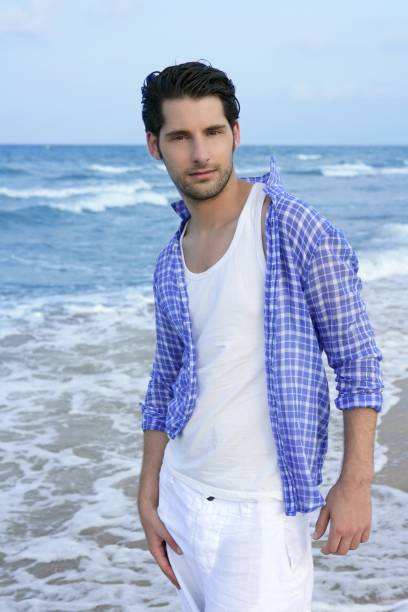 istock Mediterranean latin young man on beach 1337627574