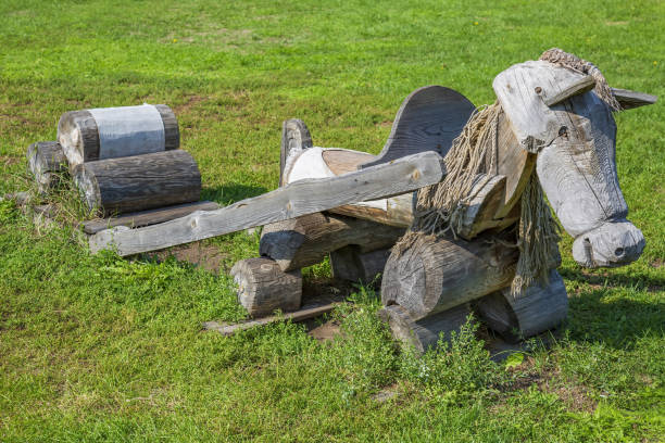 istock Comfortable wooden bench in the summer city park 1337628718
