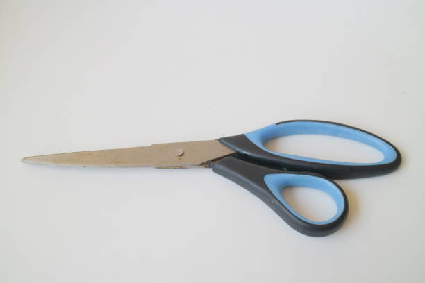 istock big blue and black scissors on white isolated background 1337630988