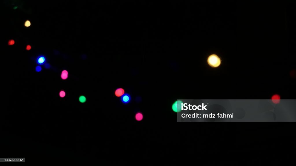 Defocused of Colorful lights that glow in the dark night Glowing Stock Photo